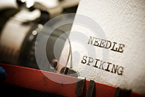 Needle spiking text photo
