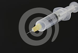 Needle and syringe on black 3