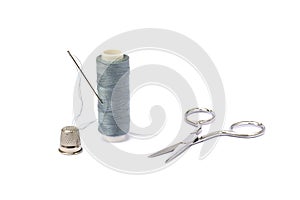 Needle, thimble, scissors, thread