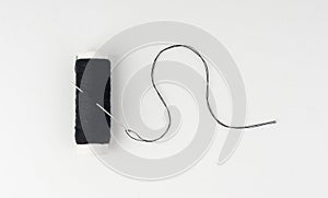 Needle and thread. Needlework object, color cotton thread spool and needle