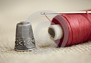 Needle, thread and thimble