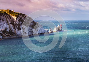 The Needles and the 19th century lighthouse on the coastline Isle of Wight