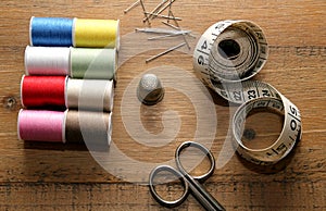 Needlework essentials on a wooden sewing table