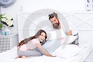She needs his unconditional love. Happy man and small child have fun in bedroom. Father and daughter relationship