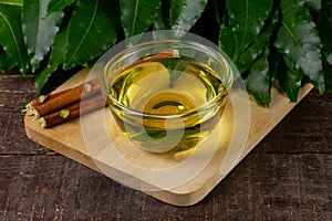 Neem oil in bowl on wooden.