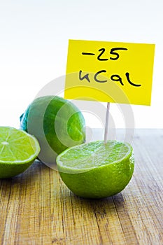 Negative-calories food, limes on a cutting board