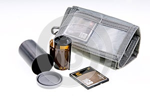 Negative and digital film. Storage canister and card wallet with card. photo