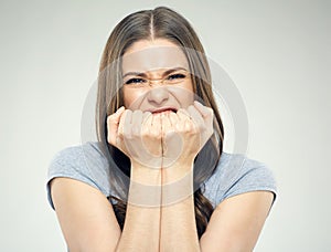 Negative emotion on face portrait of young woman.