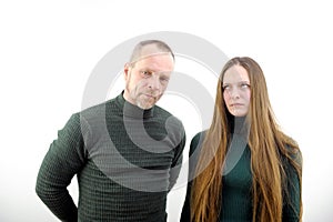 Negative emotions, quarrel, grievances and disagreements. Offended young male and female with crossed arms turned away photo