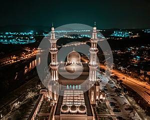 Negeri Sembilan, Malaysia - February 17, 2024 - Aerial view of an illuminated beautiful mosque during prayers at night in Sendayan