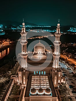 Negeri Sembilan, Malaysia - February 17, 2024 - Aerial view of an illuminated beautiful mosque during prayers at night in Sendayan