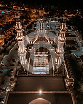 Negeri Sembilan, Malaysia - February 17, 2024 - Aerial view of an illuminated beautiful mosque during prayers at night in Sendayan