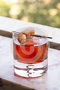 Negroni Cocktail Drink with Orange Twist on Ice