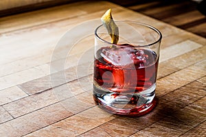 Negroni Cocktail with lemon peel and ice