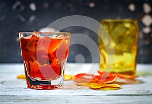 Negroni on a wooden board, grey background