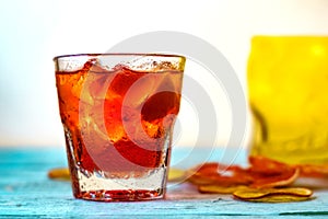 Negroni on a wooden board, white background