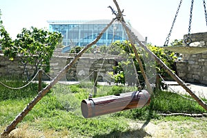 Nehra made of ancient wood. A tool to get natural fat from milk. Wooden churn hanging to make butter . A back view