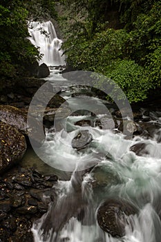 Neidong Waterfall and stream in the middle of lush forest in Taiwan