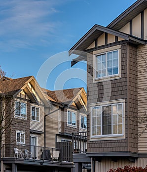 Neigbourhood of residential townhouses in light of golden sunset photo