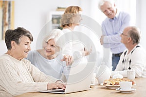 Neighbor helping older woman