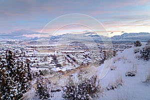 Neighborhood amidst views of fantastic mountain and white landscape in winter