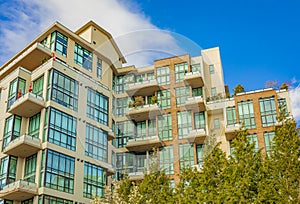 Neighborhood modern houses on sunny day in New Westminster BC. Canadian modern residential architecture