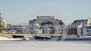 Neighborhood of old houses and modern buildings in winter. Retro versus modern style. Contrast in architecture.