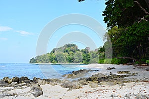 Neil`s Cove at Radhanagar Beach, Havelock Island, Andaman & Nicobar, India - Azure Water, Blue Sky, Stones and Greenery