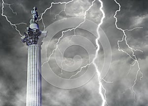 Nelson\'s Column - iconic London landmark situated in Trafalgar square with lightning photo