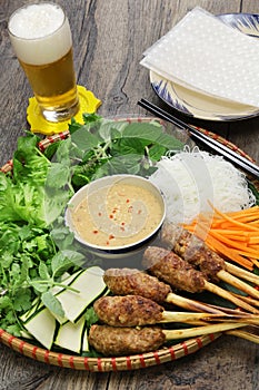 Nem lui fue, vietnamese grilled minced pork sausages on lemongrass skewers photo