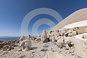 Nemrut ancient ruins statue heads on top of the mountain snowy day blue sky