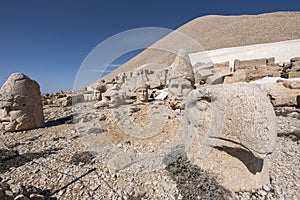 Nemrut ancient ruins statue heads on top of the mountain snowy day blue sky