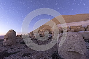 Nemrut ancient ruins statue heads on top of the mountain snowy day blue sky