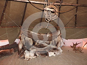 Nenets plague house, built with a large number of poles in the center of the shaft, the interior of the plague, decoration