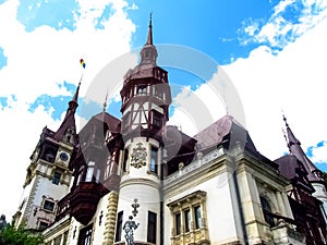 Neo-Renaissance Peles Castle, close-up, on a background of blue sky. Tourist Transylvanian attraction in the Carpathian Mountains