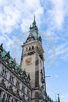 Neo-renaissance Rathaus clock tower facade at Rathausmarkt in Hamburg city hall