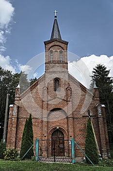 Neogothic village church with bell towe