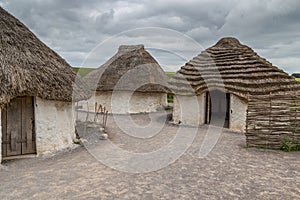 Neolithic village near Stonehenge on a cloudy day