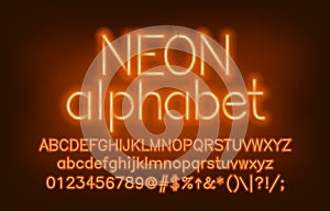 Neon alphabet font. Yellow neon light uppercase and lowercase letters and numbers.
