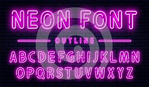 Neon alphabet with numbers. Purple neon font, fluorescent lamps on brick wall background, outline style font