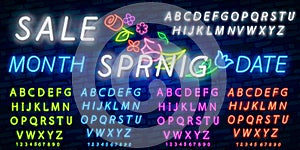 Neon alphabet and Spring Sale in flower frame over brick background. Spring sale, seasonal goods, store emblem. Spring concept.