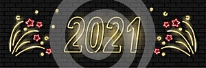 Neon banner with text 2021 happy new year and fireworks on dark brickwall background. Winter holidays, New Year concept. Night