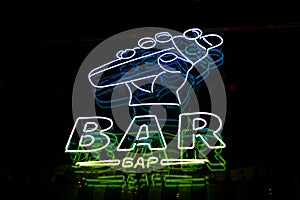 Neon bar sign outdoors