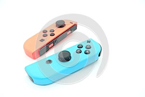 A neon blue and neon red Nintendo Switch joycon