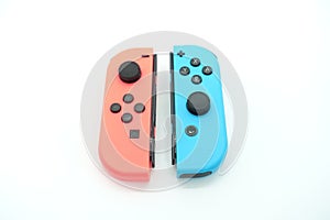 A neon blue and neon red Nintendo Switch joycon