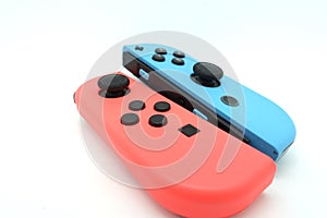 A neon blue and neon red Nintendo Switch joycon