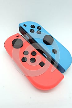 A neon blue and neon red Nintendo Switch joycon