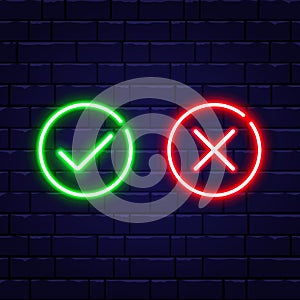 Neon check mark and red cross on brick wall. Accept and reject. Green tick and decline symbol in circle shapes. Right photo