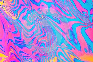 Neon colored psychodelic fluorescent striped zebra textured background