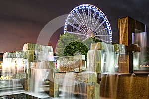 Seattle Great Wheel and Modern Fountain Sculpture at Night